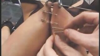 Making a uniboob by sewing one tit to another using safety pins